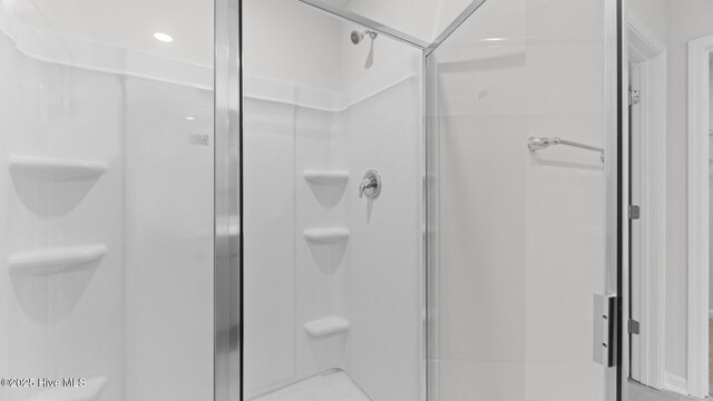 bathroom with a shower stall