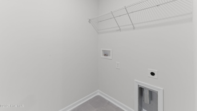 washroom with electric dryer hookup, laundry area, baseboards, and hookup for a washing machine