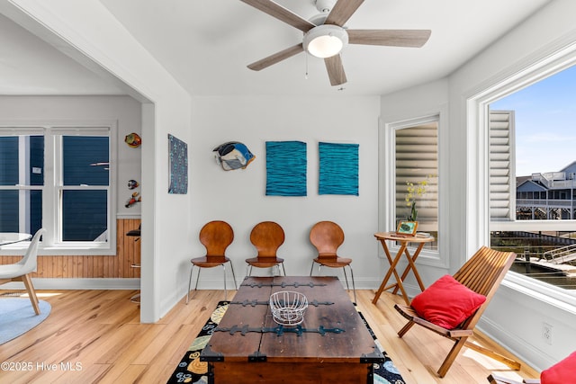 408 Dolphin St, Sunset Beach, NC 28468 - sitting room with baseboards, ceiling fan, and light wood-type flooring