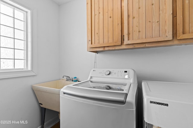 408 Dolphin St, Sunset Beach, NC 28468 - laundry area featuring washer / clothes dryer, a sink, and cabinet space
