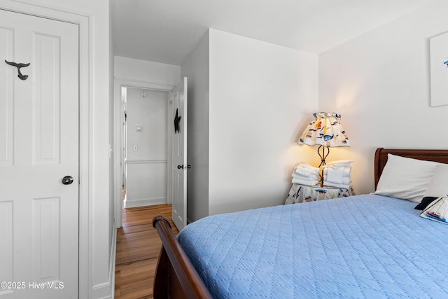 408 Dolphin St, Sunset Beach, NC 28468 - bedroom with wood finished floors