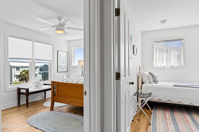 408 Dolphin St, Sunset Beach, NC 28468 - bedroom featuring baseboards, visible vents, ceiling fan, and light wood finished floors