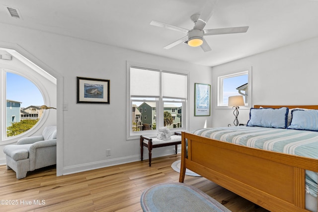 408 Dolphin St, Sunset Beach, NC 28468 - bedroom featuring a ceiling fan, baseboards, visible vents, and light wood-type flooring