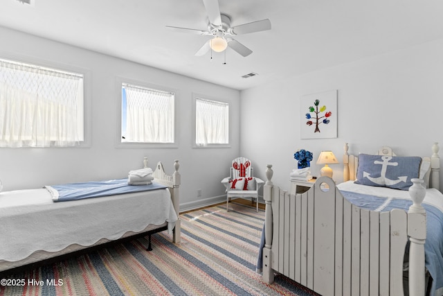 408 Dolphin St, Sunset Beach, NC 28468 - bedroom with a ceiling fan and visible vents