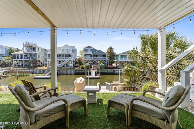 408 Dolphin St, Sunset Beach, NC 28468 - view of patio / terrace featuring a water view, a dock, and a residential view