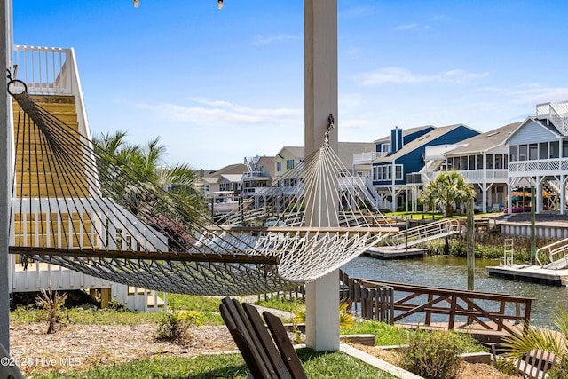 408 Dolphin St, Sunset Beach, NC 28468 - view of property's community featuring a water view, a floating dock, and a residential view