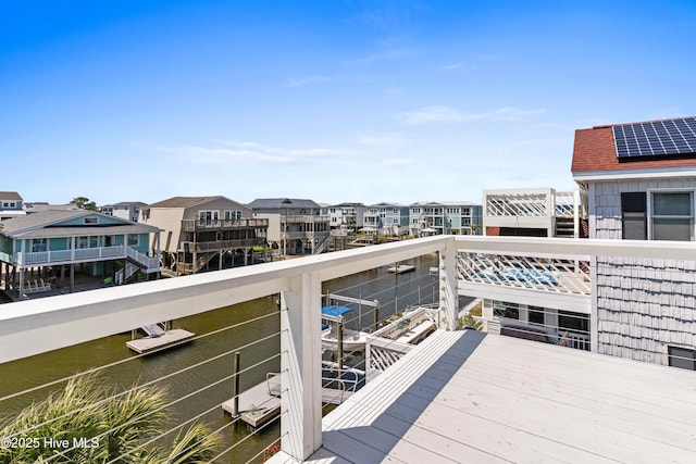 408 Dolphin St, Sunset Beach, NC 28468 - deck featuring a residential view and a water view
