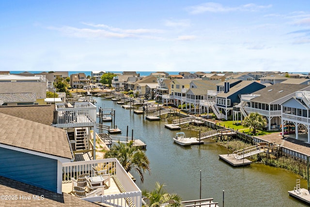408 Dolphin St, Sunset Beach, NC 28468 - view of water feature with a dock and a residential view