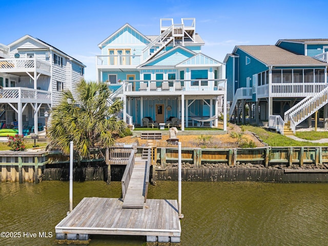 408 Dolphin St, Sunset Beach, NC 28468 - view of dock with stairs and a deck with water view