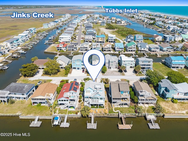 408 Dolphin St, Sunset Beach, NC 28468 - bird's eye view featuring a water view and a residential view