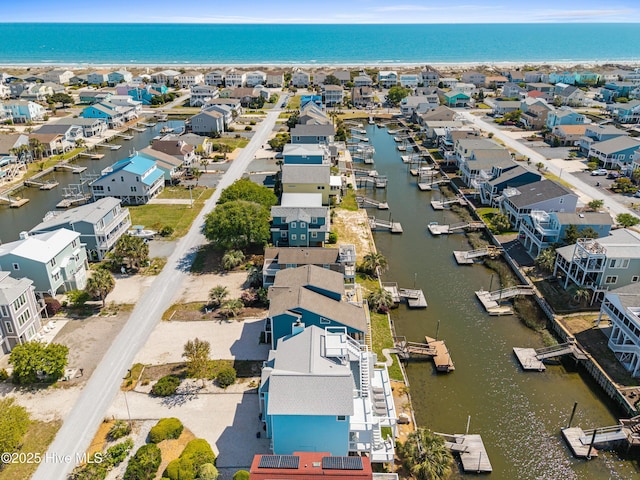 408 Dolphin St, Sunset Beach, NC 28468 - drone / aerial view featuring a water view and a residential view