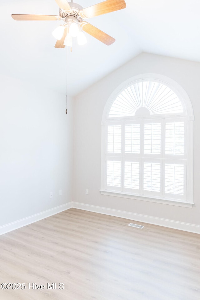 135 Live Oak Dr, Leland, NC 28451 - unfurnished room featuring visible vents, vaulted ceiling, ceiling fan, light wood-style flooring, and baseboards