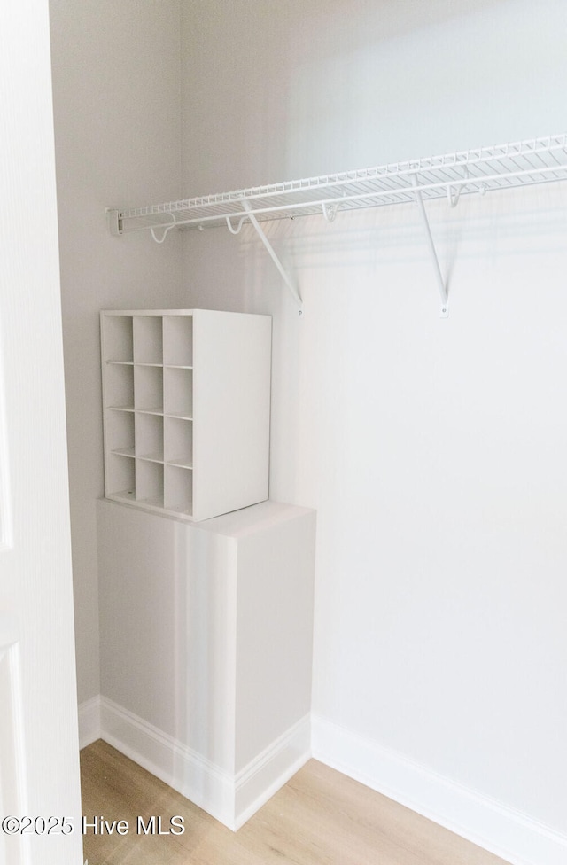 135 Live Oak Dr, Leland, NC 28451 - walk in closet with wood finished floors