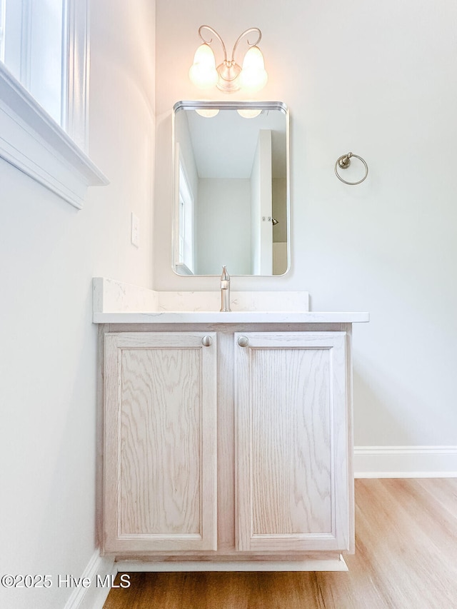 135 Live Oak Dr, Leland, NC 28451 - bathroom with vanity, baseboards, and wood finished floors