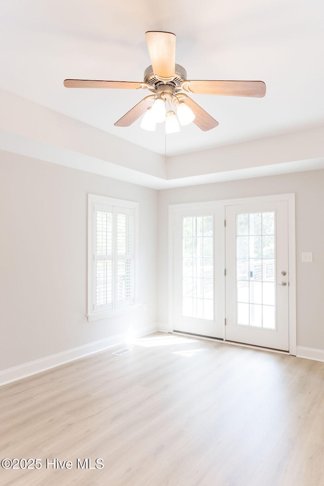 135 Live Oak Dr, Leland, NC 28451 - spare room featuring a wealth of natural light, light wood-type flooring, and a ceiling fan