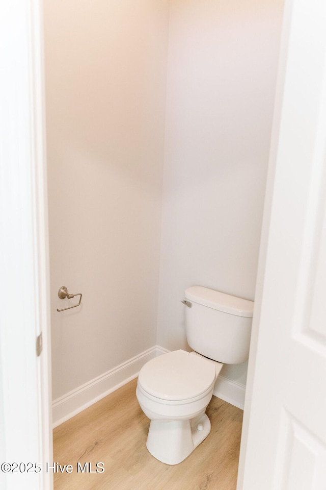 135 Live Oak Dr, Leland, NC 28451 - bathroom with toilet, baseboards, and wood finished floors