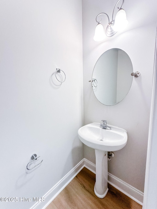 135 Live Oak Dr, Leland, NC 28451 - bathroom featuring baseboards and wood finished floors