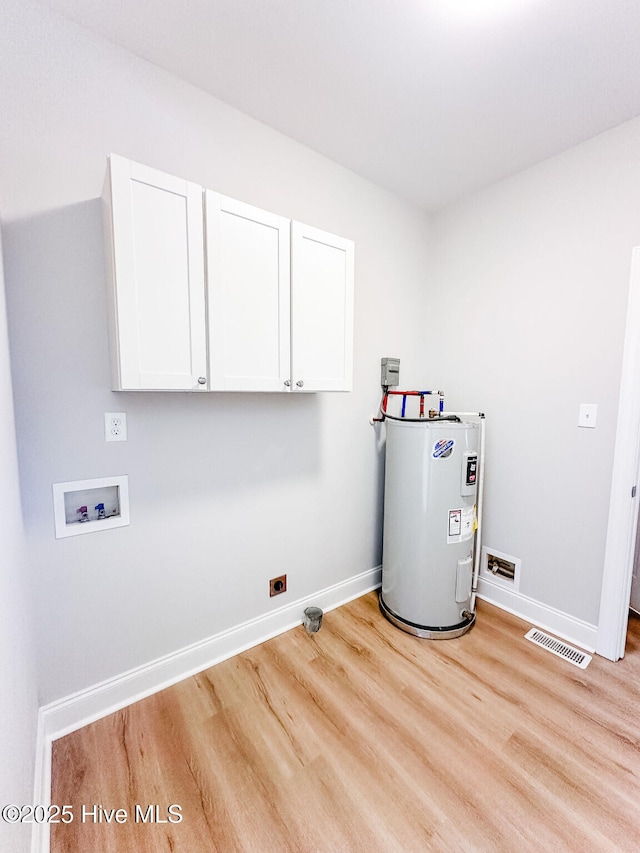 135 Live Oak Dr, Leland, NC 28451 - laundry room featuring cabinet space, visible vents, electric water heater, washer hookup, and baseboards