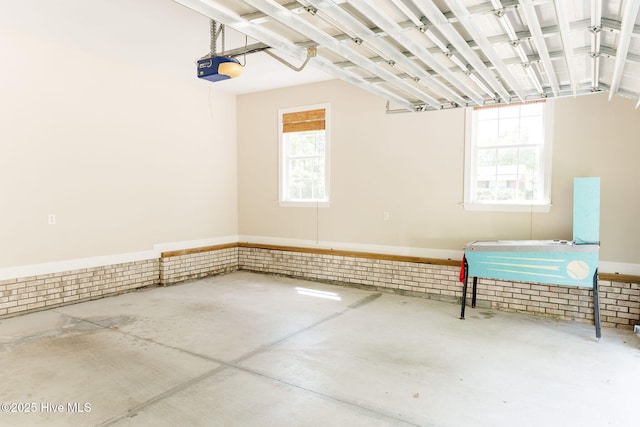 135 Live Oak Dr, Leland, NC 28451 - garage featuring a wainscoted wall and a garage door opener