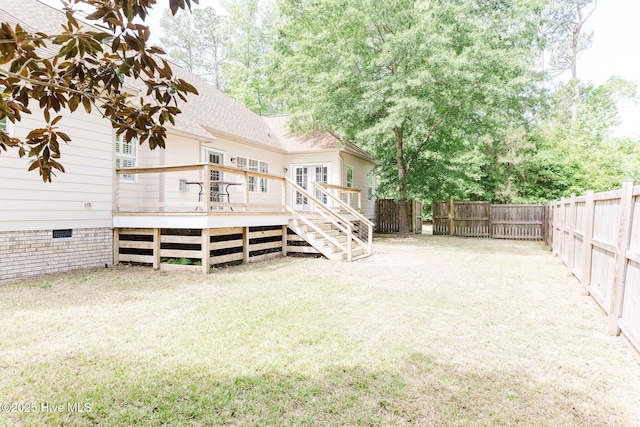 135 Live Oak Dr, Leland, NC 28451 - back of property with french doors, crawl space, a lawn, a wooden deck, and a fenced backyard