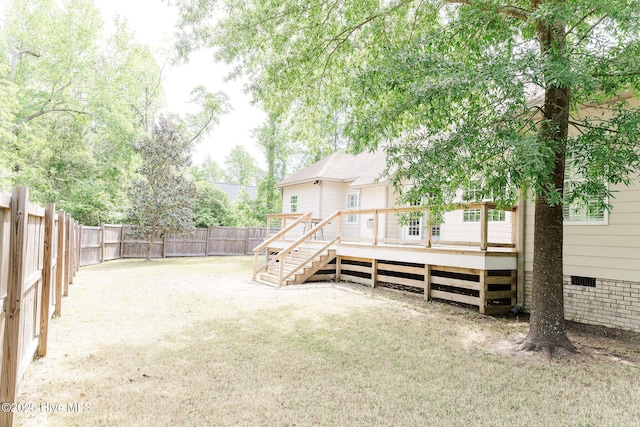 135 Live Oak Dr, Leland, NC 28451 - view of yard with stairs, a wooden deck, and a fenced backyard