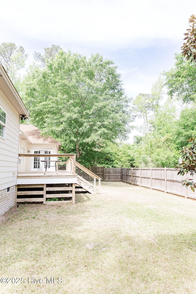 135 Live Oak Dr, Leland, NC 28451 - view of yard with a fenced backyard and a wooden deck