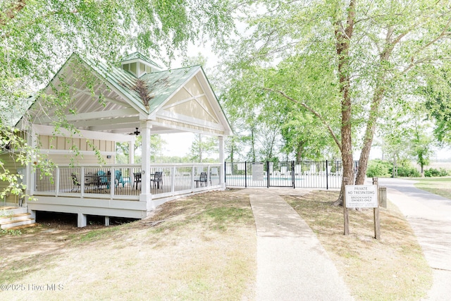 135 Live Oak Dr, Leland, NC 28451 - view of home's community with a wooden deck and fence