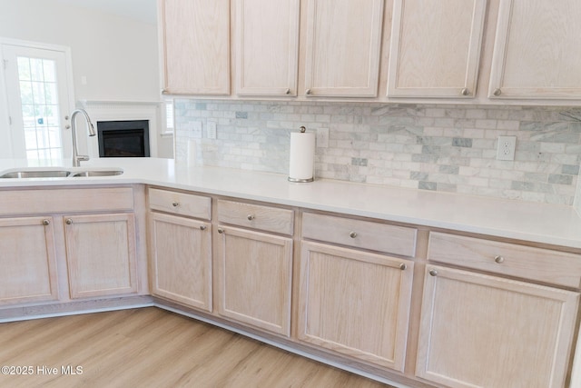 135 Live Oak Dr, Leland, NC 28451 - kitchen with light countertops, light brown cabinets, and a sink