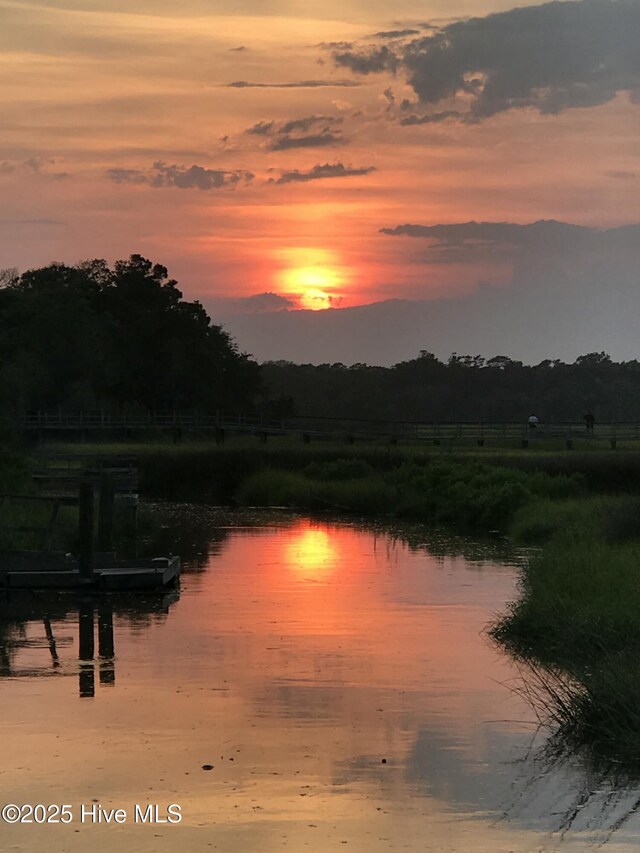 property view of water featuring a dock