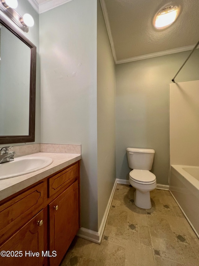 full bath with crown molding, vanity, toilet, baseboards, and shower / bath combination
