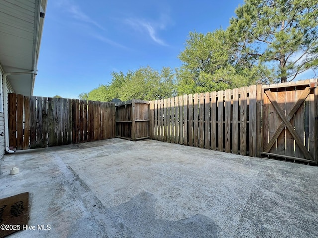 view of patio / terrace featuring a gate and fence