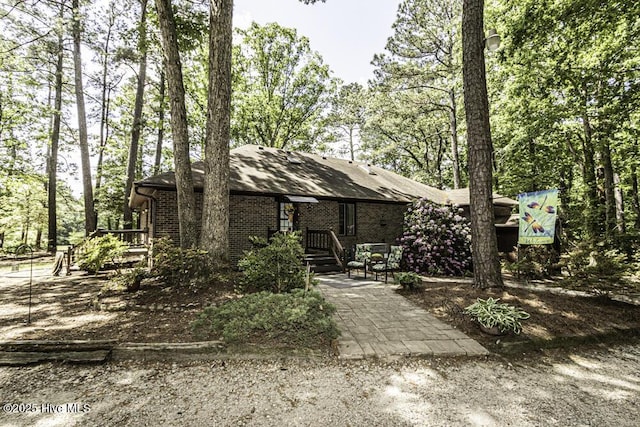 7730 Old Raleigh Rd, Bailey, NC 27807 - view of front of house featuring a patio and brick siding