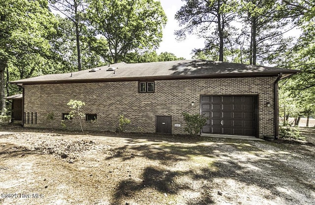7730 Old Raleigh Rd, Bailey, NC 27807 - view of property exterior with brick siding and a garage
