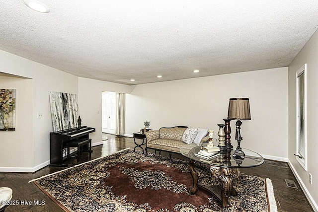 7730 Old Raleigh Rd, Bailey, NC 27807 - living area with recessed lighting, dark wood finished floors, visible vents, and a textured ceiling