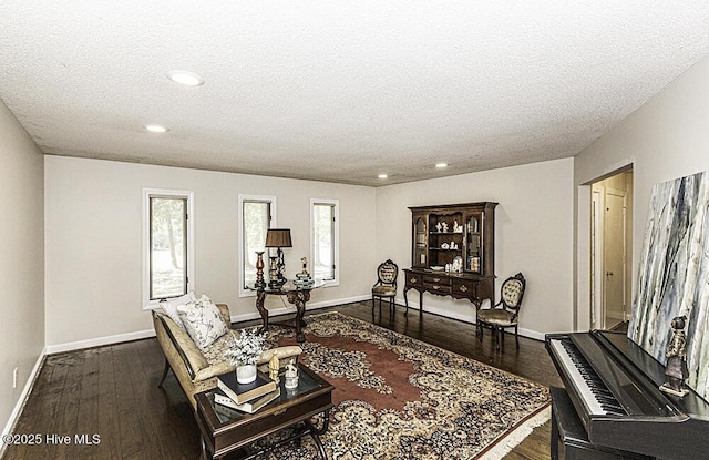 7730 Old Raleigh Rd, Bailey, NC 27807 - living area with recessed lighting, a textured ceiling, baseboards, and dark wood-style floors