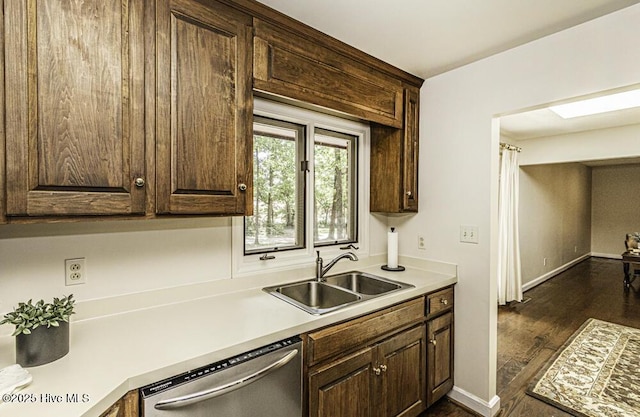 7730 Old Raleigh Rd, Bailey, NC 27807 - kitchen featuring dark brown cabinetry, stainless steel dishwasher, dark wood-style flooring, and a sink