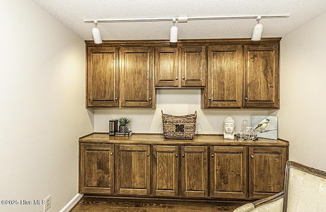 7730 Old Raleigh Rd, Bailey, NC 27807 - bar with track lighting and a textured ceiling