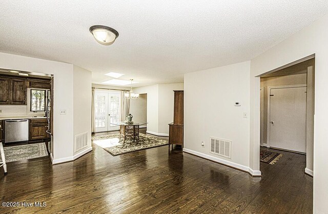 7730 Old Raleigh Rd, Bailey, NC 27807 - interior space with a textured ceiling, visible vents, and dark wood-style floors