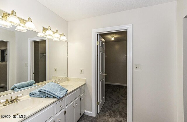 7730 Old Raleigh Rd, Bailey, NC 27807 - full bathroom with double vanity, baseboards, and a sink