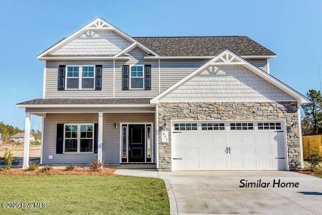 153 Tides End Dr, Holly Ridge, NC 28445 - craftsman house featuring stone siding, driveway, a garage, and covered porch