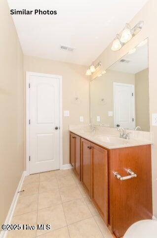 153 Tides End Dr, Holly Ridge, NC 28445 - bathroom featuring tile patterned flooring, vanity, and baseboards