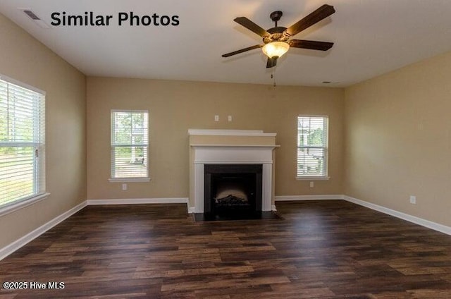 153 Tides End Dr, Holly Ridge, NC 28445 - unfurnished living room featuring dark wood finished floors, a fireplace with flush hearth, ceiling fan, and baseboards