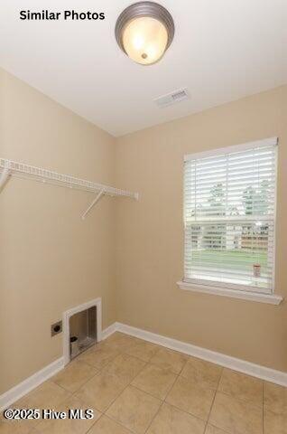 153 Tides End Dr, Holly Ridge, NC 28445 - washroom featuring electric dryer hookup, light tile patterned floors, and baseboards