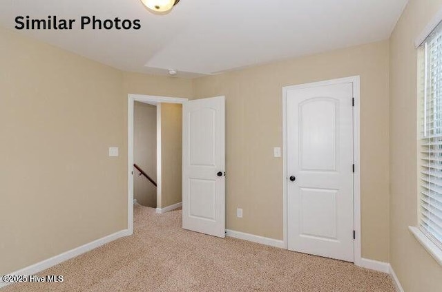 153 Tides End Dr, Holly Ridge, NC 28445 - unfurnished bedroom with light colored carpet and baseboards