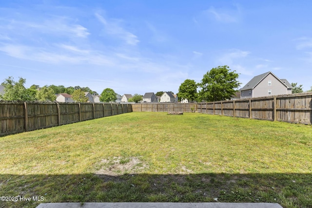 view of yard with a fenced backyard