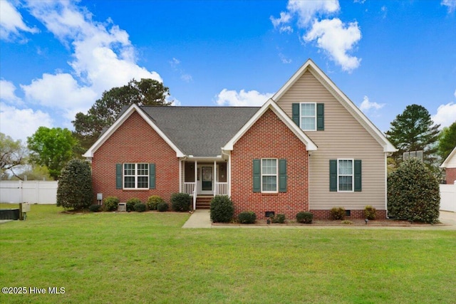 view of front of house featuring crawl space, fence, and a front lawn