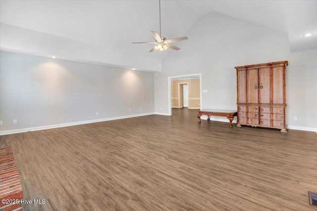 unfurnished room featuring ceiling fan, visible vents, wood finished floors, baseboards, and high vaulted ceiling