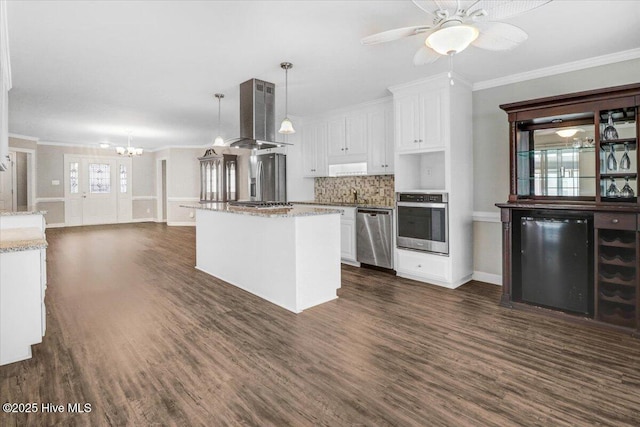 kitchen featuring white cabinets, dark wood-style flooring, appliances with stainless steel finishes, ventilation hood, and ornamental molding