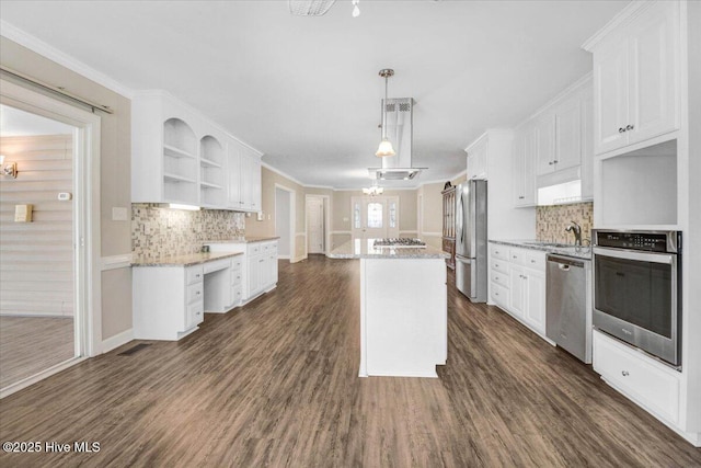 kitchen with stainless steel appliances, open shelves, and white cabinetry