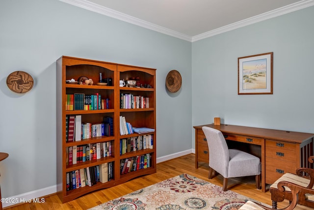 home office with crown molding, baseboards, and wood finished floors